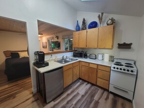 Open concept kitchen fully stocked with all you need to enjoy your stay!