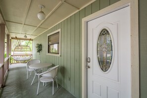 Have coffee on the front porch and enjoy the outdoor swing chair. 