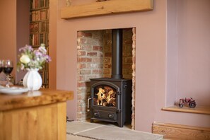 Lime Kiln Farm, near Malton: The sitting room with wood burning stove