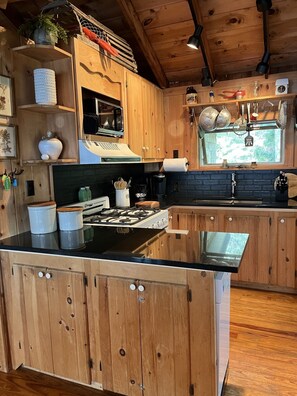 The kitchen with all of the modern day appliances