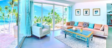 The cozy living room is full of sunlight and the ocean breeze. 