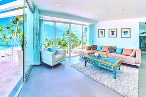 The cozy living room is full of sunlight and the ocean breeze. 