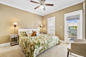 Master bedroom with ensuite bathroom and screened in porch/veranda.