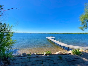 view from stone patio at lake's edge