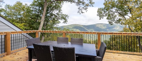 Enjoy a meal at the outdoor eating area with this mountain view as your backdrop