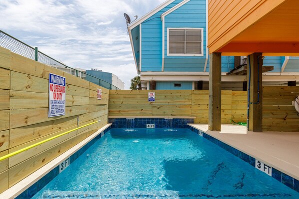 Come relax at the pool after a day at the beach.