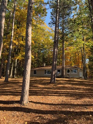 Cottage from backyard- sits on a quiet 1-acre wooded lot with great views!