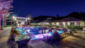 The estate glows with colorful lights and unforgettable nighttime vibes!
