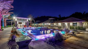 The estate glows with colorful lights and unforgettable nighttime vibes!