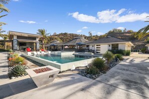 Soak, sip, and unwind in this showstopping pool and lounge area!