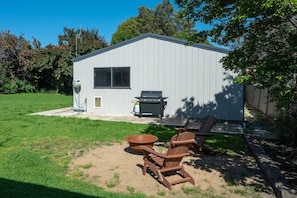 An expansive backyard allows for a BBQ feast and a round of s'mores by the fire pit.