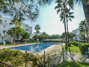 Water, Plant, Sky, Building, Property, Tree, Swimming Pool, Arecales, Chair, Condominium