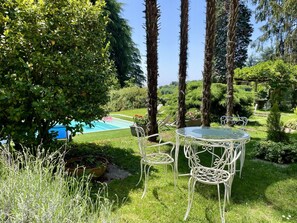 Plant, Water, Tree, Table, Natural Landscape, Outdoor Furniture, Shade, Outdoor Table, Chair, Rectangle