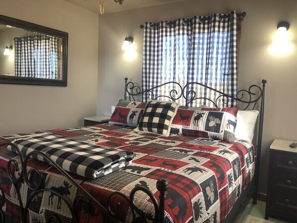 Bedroom with Smart TV & air conditioning unit