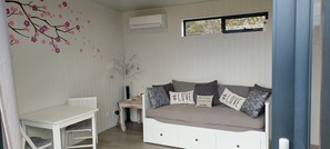 Lounge with table & chairs - Day bed 
Air con @ Frankland River Chalet Retreat