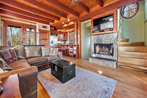 Cozy up around the gas logs fireplace in the den to stream your favorites on the 4K TV (Roku stick and Hulu Live subscription)