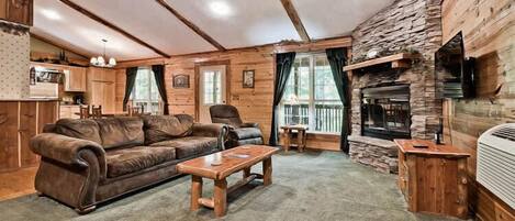 Living Area with Smart TV, Fireplace, and Queen Sleeper Sofa