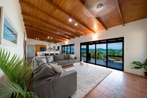 Extra large living area open to kitchen and deck with smart TV