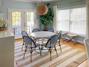 You have enough room to seat six at the table and an additional three at the adjacent bar.