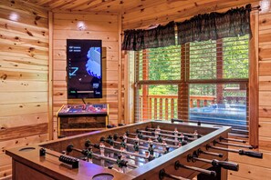 This home features a game and theater room that boasts a 70” 4K HDTV.