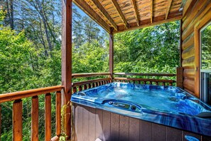 Private hot tub overlooking the forest.