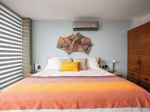 Expansive master bedroom with a king bed and private ensuite—your own comfortable retreat.
