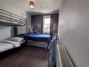 Blue bedroom - king size bed and bunk beds