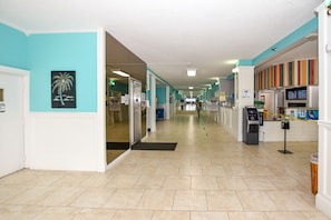 THE MAIN FLOOR CONTAINS AN ICE MACHINE, VENDING MACHINES, WASHER/DRYERS AND AREA