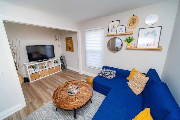 downstairs living room, with pull out sofa bed and additional mattress available