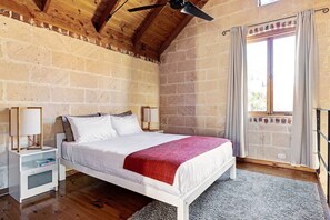 Upstairs main Loft Bedroom with queen bed. Has ceiling fan and light operated via a remote control