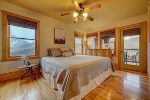 Primary King Bed- Upstairs bedroom off main living, private access to screened in deck