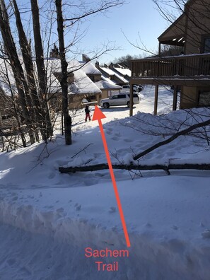 View from Sachem Trail to unit.  Entrance is in front of the white SUV
