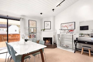 A dining table for 4, wood burning fireplace, working desk space and contemporary bar are amenities found in this rental.