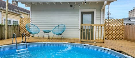 Above ground pool in backyard