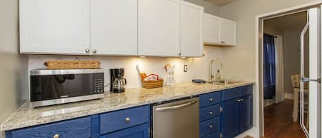 New Kitchen w/dishwasher.  Microwave / Air Fryer Combo.  Sink has touch faucet.