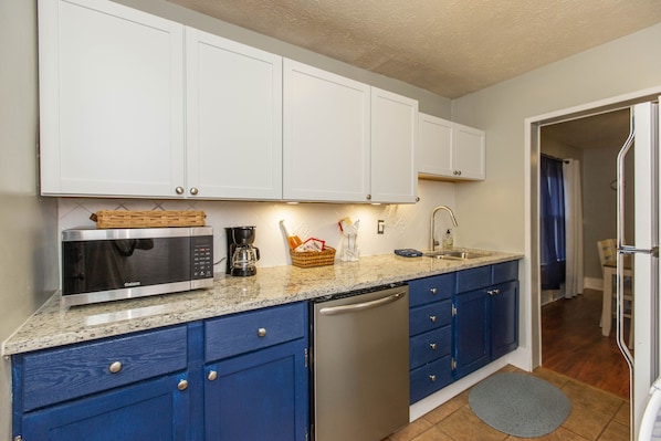 New Kitchen w/dishwasher.  Microwave / Air Fryer Combo.  Sink has touch faucet.