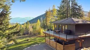 View of home including the new hot tub/privacy fence