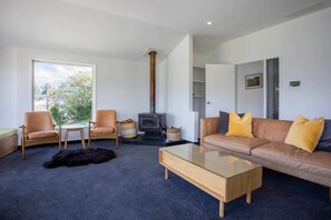 Lazing on comfortable seating at your Queenstown 2 bedroom accommodation