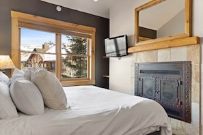 Fireplace and ensuite bathroom in the main bedroom