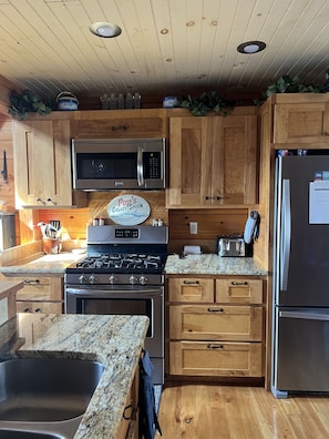 Kitchen with stainless steel appliances.