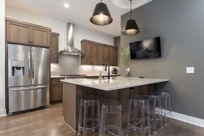 Enjoy your meals on the large kitchen island with bar seating.