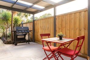 Outdoor space for two including and a BBQ to cook on