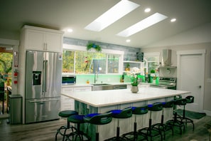 Spacious kitchen, newly remodeled with new appliances and ultra-cushioned stools