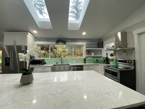 Skylights bring natural light in the kitchen and living room