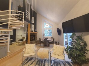 Beautiful dining room with wood burning stove and forest views!  