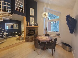 Beautiful dining room w/ wood burning stove & forest views!