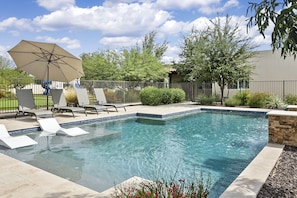 Private gated pool with plenty of seating and hot tub
