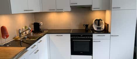 Kitchen area with all modern appliances.