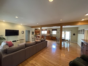 Living Room and Foyer connects to Dining and Kitchen spaces.