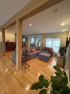 Spacious Living Room with high ceilings and "real" hardwood flooring.